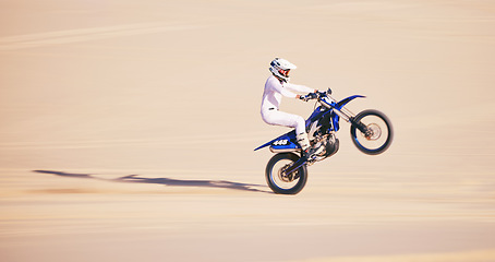 Image showing Bike, sand and mockup with a man in the desert for adrenaline, adventure or training in nature. Moto, sports and balance with a male athlete riding a motorcycle for freedom or fitness on space