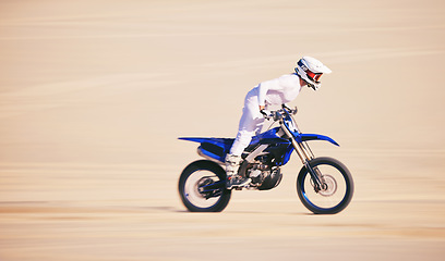 Image showing Race, motorbike and person in desert, action and extreme sport with speed, riding outdoor and mockup space. Adventure, fitness and training, motorcycle exercise and freedom, challenge and performance