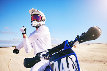 Image showing Sports, cycling and man stretching on motorbike on sand for adrenaline, adventure and freedom in desert. Fitness, extreme action and male person on bike on dunes for training, exercise and challenge