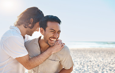 Image showing Love, laugh and gay couple, men on beach with hug and smile on summer vacation together in Thailand. Sun, ocean and mockup, happy lgbt people embrace in nature for on holiday with pride, sea and fun.