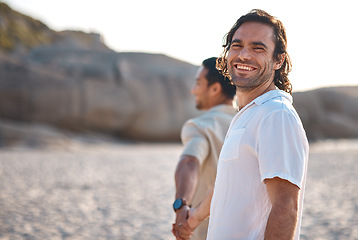 Image showing Holding hands, portrait or happy gay couple on beach on fun summer vacation together in Brazil, Sao Paulo. Smile, ocean or lgbtq men walking in nature on romantic holiday with pride, freedom or care