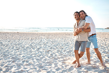 Image showing Love, hug and gay men on beach, mockup and laugh on summer vacation together in Thailand. Sunshine, ocean and romance, happy lgbt couple embrace in nature for fun holiday with pride, sea and sand.