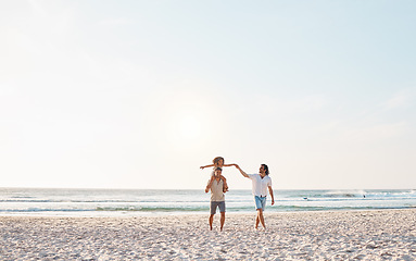 Image showing Beach, LGBTQ and walking child, happy family and fathers enjoy fun summer time, ocean vacation and nature freedom. Love, mockup sky and homosexual couple bonding with adoption kid on shoulders of dad