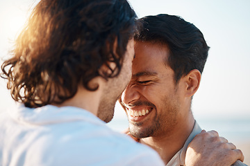 Image showing Love, sunshine and gay men on beach, embrace and laugh on summer vacation together in Thailand. Sunshine, ocean and island, happy lgbt couple hug in nature on fun holiday with pride, sea and smile.