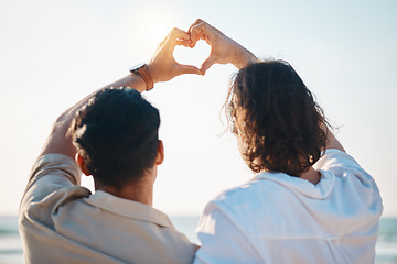 Image showing Love, heart hands and gay men on beach, hug from back on summer vacation together in Thailand. Sunshine, ocean and romance emoji, lgbt couple embrace in nature and holiday with pride, sea and fun.