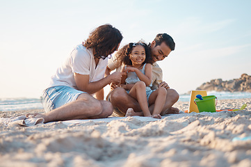 Image showing Happy, playing and a lgbt family at the beach for summer relax, love and travel together. Smile, vacation and gay men with a girl kid at the ocean for a holiday, fun and laughing on the sand
