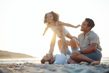 Image showing Lgbt men, child and playing on beach at sunset, airplane games and island holiday together. Love, happiness and sun, gay couple on tropical ocean vacation, parents with daughter on fun picnic on sand