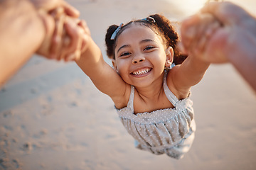 Image showing Girl child, swing and pov at beach, portrait and smile for game, holding hands or speed in summer. Young female kid, parent and spin in air, sand or happy for family bonding, love or care in sunshine