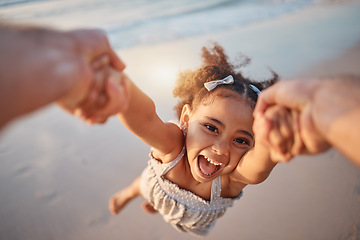 Image showing Girl child, spin and pov by ocean, portrait and smile for game, holding hands or speed in summer. Young female kid, parent and swing in air, sand or happy for family bonding, love or care in sunshine