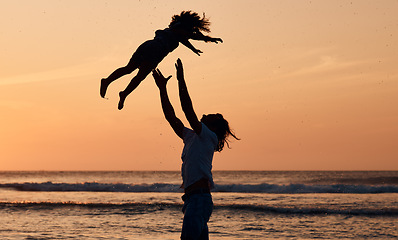 Image showing Child, sunset or father by ocean to play a game in Rio de Janeiro in Brazil with support, care or love. Throw, parent and lifting kid in air at sea to enjoy family bonding together in nature by water