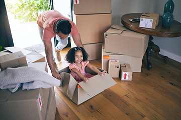 Image showing Dad, child and box in new home for games, fun and freedom on floor of real estate property from above. Happy father, excited family and girl kid play in cardboard boxes for race while moving in house