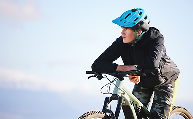 Image showing Thinking, fitness and a man cycling in nature for exercise, cardio or training idea with mockup. Health, space and a male cyclist with a bike for travel, outdoor sports or a workout for an athlete