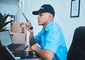 Image showing Walkie talkie, security guard and man at table in surveillance, communication in an office. Safety, protection and serious officer on radio at desk to chat on tech in police investigation service.