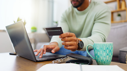 Image showing Laptop, ecommerce or happy man online shopping with credit card for digital product with discount code. Smile, promo or customer with financial payment to buy on sale on fintech application at home