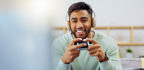 Image showing Gaming, winner and esports with a man in the living room of his home, playing a video game for fun. Winning, celebration and next level with a gamer using a joystick controller to play console games