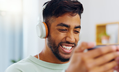 Image showing Laugh, happy and mobile text of a black man typing on social media communication app. Laughing, internet scroll and web meme of a man online on a mobile phone texting and reading a funny joke