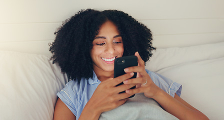 Image showing Phone, happy woman and bed of a young female texting on a social media app in the morning. Wifi, web networking and happiness of a young person with a smile in a house writing a text in a chat