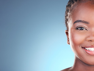 Image showing Portrait of black woman with mockup space for skincare, beauty and smile on blue background. Spa aesthetic, dermatology and half face of person in studio with cosmetics, makeup and glow for wellness