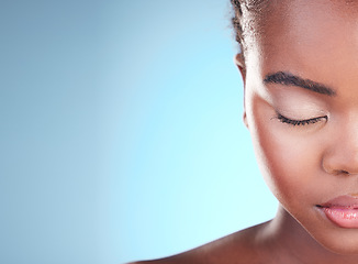 Image showing Beauty, half face mockup and black woman relax with self care wellness, eyeliner cosmetics or eyebrow treatment. Advertising makeup, studio space or African person with eyes closed on blue background