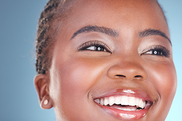 Image showing Face of happy black woman for skincare, beauty and facial on blue background for wellness, health and spa. Salon aesthetic, dermatology and closeup of person in studio with cosmetics, makeup and glow