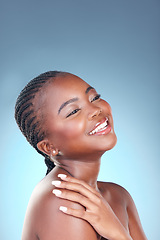 Image showing Face of African woman for skincare, beauty and smile on blue background for wellness, health and spa. Salon aesthetic, dermatology and happy person in studio with cosmetics, makeup and facial glow