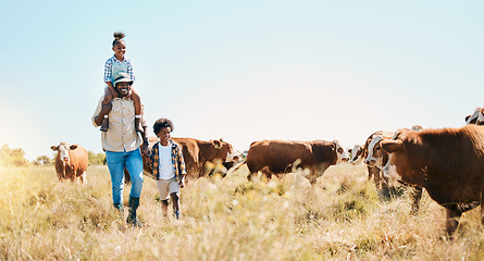 Image showing Cattle farm, father and children or family outdoor for travel, sustainability and holiday. Black man and kids walking on a field for farmer adventure in countryside with cows and banner in Africa