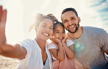 Image showing Family, parents and child in selfie at beach, travel and bonding with sunshine, summer and fun together with memory. Man, woman and girl kid smile in picture, portrait and adventure with vacation