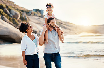 Image showing Family on beach, kid on father shoulders and travel with bonding, love and walking together in nature. Vacation, ocean and happy people outdoor, parents and kid with sunshine and adventure with fun