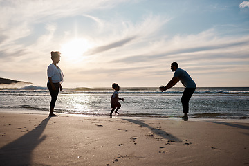 Image showing Beach, sunset and family in nature with freedom, play or bond on travel, trip or vacation together. Ocean, games and excited girl child running to dad at sea happy, love or enjoy holiday with parents