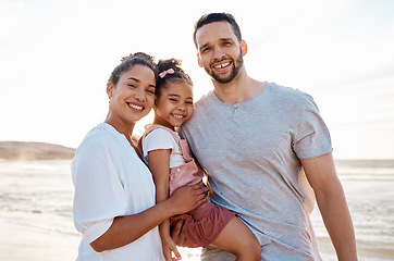 Image showing Family, beach and portrait, parents and child with travel and bonding, love and happiness together outdoor. Vacation, ocean and happy people in nature, man and woman with kid, sunshine and adventure