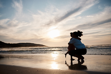 Image showing Mother, child and hug at beach in silhouette with sunset, mockup and love on island holiday together. Embrace, mom and kid at ocean with sky, waves and space at water on tropical vacation with trust.