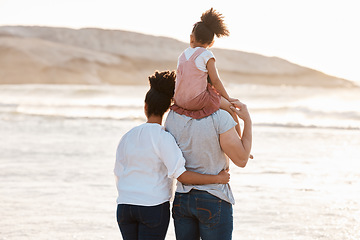 Image showing Family, beach and watch sunset and ocean, travel and bonding, love with back view and together outdoor. Vacation, waves and people in nature, man and woman with kid, sunshine and adventure with peace