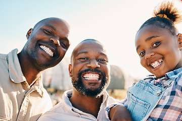 Image showing Farm, black family and portrait of parents with girl in countryside for holiday, adventure and vacation. Travel, sustainable farming and lgbtq fathers with child for bonding, relax and fun in nature