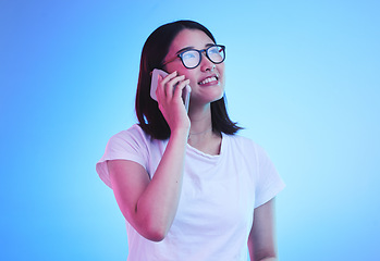 Image showing Phone call, thinking an Asian woman in conversation using mobile app to contact person online for talking or discussion. Connection, cellphone and young female speaking with smile for communication