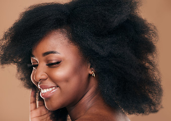 Image showing Beauty, face and hair with a model black woman in studio on a brown background for natural cosmetics. Smile, makeup and haircare with a happy young afro female person indoor for shampoo treatment