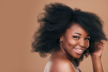 Image showing Portrait, hair care and black woman with smile, beauty and wellness on a brown studio background. Mockup space, person and model with texture, afro and natural with aesthetic, makeup and cosmetics