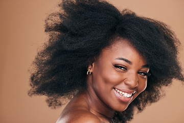 Image showing Portrait, hair care and black woman with beauty, afro and smile on a brown studio background. Cosmetics, person and African model with texture, shine and volume with aesthetic, wellness and glow