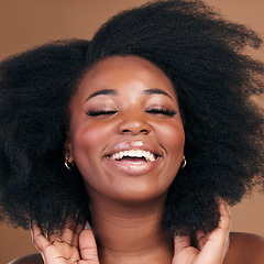 Image showing Beauty, black woman and hair care for afro, smile or volume on a brown studio background. Growth, hairstyle or African model with cosmetics after salon treatment, wellness or funny with natural shine