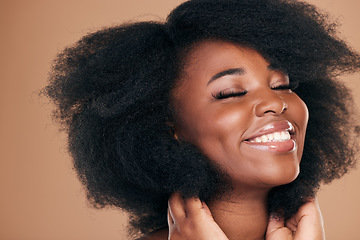 Image showing Natural beauty, black woman and care for afro hair, smile and volume on a brown studio background. Aesthetic, hairstyle and African model with cosmetics after salon treatment, wellness and texture