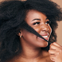 Image showing Beauty, hair and happy with a model black woman in studio on a brown background for natural cosmetics. Face, smile and haircare with a confident young afro female person indoor for keratin treatment