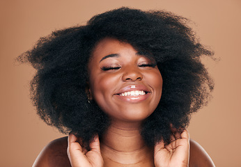 Image showing Beauty, black woman and hair care for afro, natural and smile on a brown studio background. Growth, hairstyle or African model with cosmetics after salon treatment, makeup and wellness with luxury