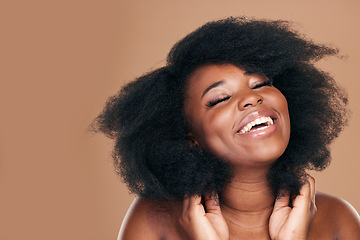 Image showing Smile, black woman and hair care for afro, natural and beauty on a brown studio background. Growth, hairstyle and African model with cosmetics, mockup space or volume with salon treatment pr wellness