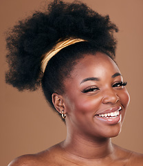 Image showing Portrait, natural afro or happy black woman with hair care, self love or smile on a brown studio background. Hairstyle, healthy growth or African model with glow or beauty with aesthetic or wellness