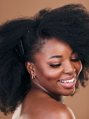 Image showing Hair care, natural afro or happy black woman with self love, shine or smile on a brown studio background. Hairstyle, healthy growth or African model with glow or beauty with aesthetic or wellness