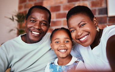 Image showing Selfie of black family in home, parents and kid with bonding, love and relax in living room together. Portrait of happy mom, dad and girl child in apartment with smile, man and woman with daughter.