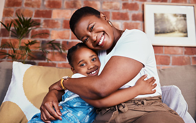 Image showing Portrait, mother and daughter on sofa with hug, smile and relax bonding in living room together. Love, mom and girl child on couch in house, happy embrace and support, trust and black woman with kid