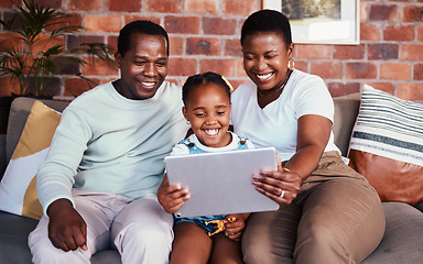 Image showing Family, tablet and child with internet on a home sofa for e learning, bonding and time together. Happy man, woman and girl kid in a lounge with technology for education, online game or to watch movie