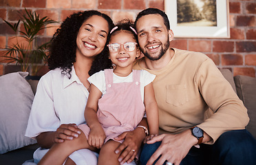 Image showing Portrait of family in home, parents and child on sofa with love, bonding and relax in living room. Mom, dad and girl kid on couch in apartment with smile, happy man and woman with daughter together.