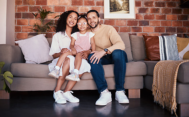 Image showing Portrait of happy family in living room, parents and child on sofa with love, bonding and relax in home. Mom, dad and girl kid on couch in apartment with smile, man and woman with daughter together.