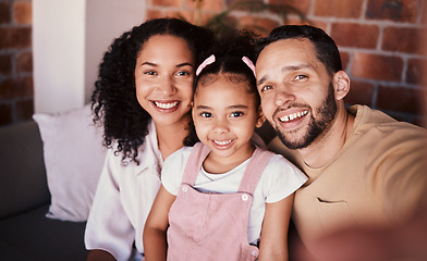 Image showing Selfie of family in living room, parents and child with love, smile and relax on sofa in home. Portrait of mom, dad and girl on couch in apartment, happy man and woman with daughter bonding together.